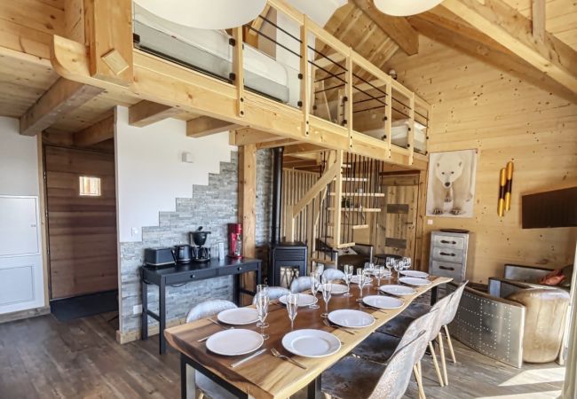 dining-room-with-wooden-table-lounge-area-and-mezzanine