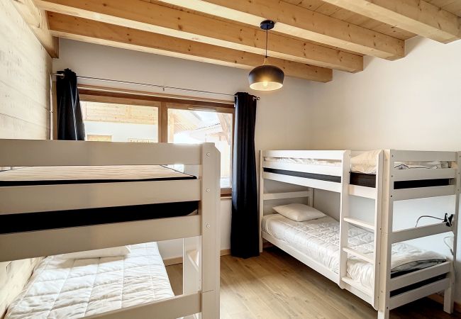 Bedroom-with-two-bunk-beds-and-trundle-bed